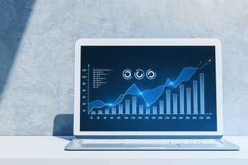 Sticker - Close up of laptop with growing digital business chart on concrete wall background. Business strategy development and growth plan. 3D Rendering.