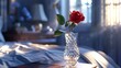 A delicate, crystal bud vase with a single, perfect red rose, on an elegant bedside table
