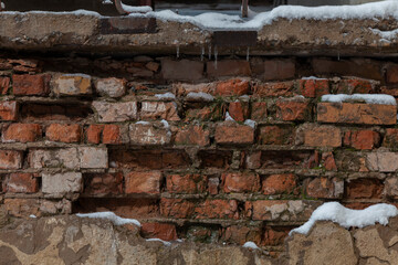 Wall Mural - Texture of old shattered brick walls with plaster