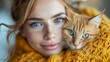 A lovely lady in a knitted sweater shares a sweet moment with a cute cat. Expressive eyes and a glamorous aura make this portrait truly enchanting.