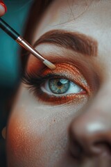 Poster - Close-up shot of a woman's eye being painted with a brush. Ideal for beauty and makeup concepts
