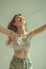 Poster - A woman with her arms outstretched in the air. Perfect for wellness and freedom concepts