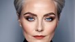 © Viktor - A woman with gray hair and blue eyes wears a black shirt and a bow tie, gazing into the camera