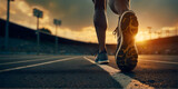 Fototapeta  - A focus on the shoes of an athlete running on a track