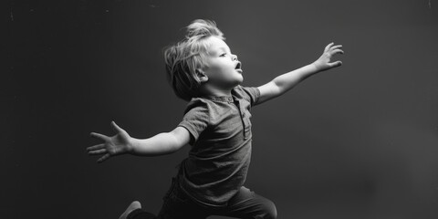 Poster - A young boy jumping in the air. Suitable for various projects