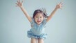 A joyful little girl jumping in the air, perfect for advertising campaigns