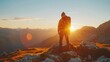 A person standing on top of a mountain at sunset. Perfect for inspirational and motivational concepts