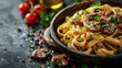   A tight shot of a bowled pasta topped with mushrooms and parsley, placed beside a pepper shaker on the table