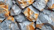   A tight shot of rocky mass with orange and gray paint chips flaking from its edges