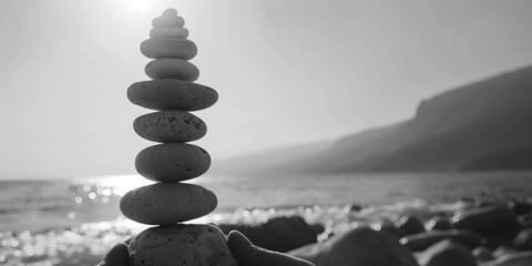 Poster - A stack of rocks on a sandy beach, ideal for nature and relaxation concepts