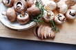 Champignon mushroom on the wooden table. healthy food concept decoration background. Mushrooms composition on wooden plate. 
