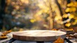 empty wooden tabletop podium in open garden forest, blurred background of autumn plants with space. organic product present natural placement pedestal display, autumn concept