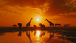   A group of giraffes gather beside a tranquil water body as the sun sets, with avian figures soaring in the azure sky