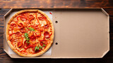 Fototapeta  - Pepperoni pizza with bell peppers and arugula in open carton box on dark wooden table flat lay with copy-space