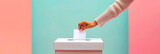 Fototapeta  - Close-up image of hands voting in ballot box on pastel background