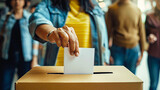 Fototapeta  - Close-up image of hands voting in ballot box