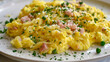 Argentine cuisine: scrambled eggs with diced ham, green peas, and herbs