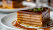 Close-up of a luscious argentine caramel layered cake on a white plate