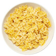 Raw farfalle pasta in a bowl isolated on white background. File Contains Clipping Path.