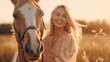 Young cute happy joyful satisfied smiling woman stroking beautiful blond palomino horse at meadow at sunset.