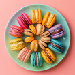 A top-down shot of a colorful assortment of macarons arranged in a circular pattern on a pastel-colored plate, showcasing various flavors and vibrant hues.