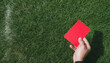 Soccer Concept. Red foul card in background grass with copy-space.