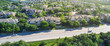 © trongnguyen - Panorama aerial view large nature park busy car in out near new development suburban apartment complex Brushy Creek Road, Cedar Park, Austin, Texas, lush green trees Whippoorwill neighborhood