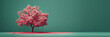 Blooming cherry tree with pink flowers on green background with copy space