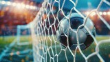Fototapeta Sport - Football on the stadium with the ball in the net Football game banner