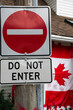 do not enter sign juxtaposed with a Canadian flag. concept of immigration, refugee and housing crisis.
