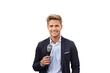 Young handsome blonde man as a reporter holding a microphone and reporting news on isolated chroma key background