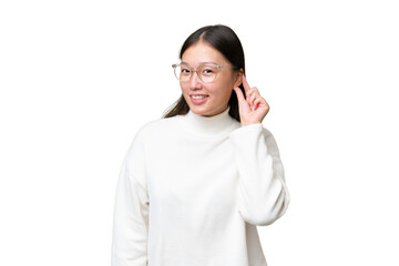 Wall Mural - Young Asian woman over isolated background laughing