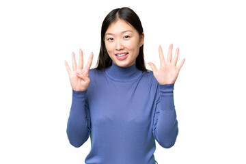 Wall Mural - Young Asian woman over isolated chroma key background counting nine with fingers