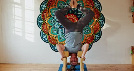 Wall Mural - Woman, yoga and head stand with pose for healthy body, mindfulness and holistic flexibility. Female person, zen and relax with equipment for spiritual peace, wellbeing and chakra in gym studio