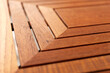 Edge and corner of wooden table. Closeup