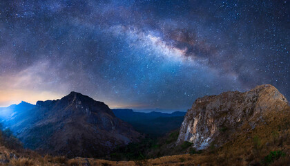 Wall Mural - Beautiful milky way and mountain peak. Dark blue starry sky.