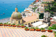 view of Positano town - famous old italian resort with church dome at summer day, Italy