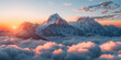 Breathtaking Sunrise Over Snow-Capped Mountain Peaks and Clouds