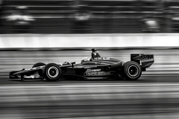 A race car speeding on a racetrack.