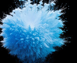 Fototapeta Mapy - an explosion of blue powder paint . Closeup of blue dust particles splattered isolated on black background.