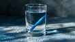 © Orxan - Demonstration of light refraction with a blue pencil inside a water-filled glass