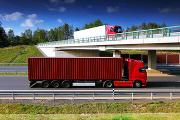 Wall Mural - Large Transportation Truck on a highway road through the countryside