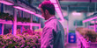 © Eugen - a man is standing in a greenhouse looking at plants. Generative AI