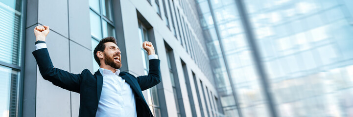 Wall Mural - Happy satisfied businessman rejoices in successful deal or win