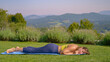 Exhausted lady lying on yoga mat after holding strenuous plank pose for too long