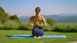 Peaceful outdoor yoga meditation in a sunny garden among fragrant lavenders