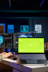 Poster - focus on green screen laptop used by developer to update artificial intelligence machine learning al