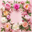 Floral frame arrangement on pink background