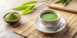 a cup with matcha and matcha powder lying on the table. next to them are branches of bamboo leaves on  a beige background, minimalism style generated by AI