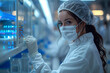 © Aleksandr Matveev - A woman in a lab coat is wearing a mask and gloves while working with vials. The scene is blurry and has a sense of urgency, as if the woman is working on an important project